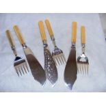 Three pairs of ivory handled fish knives & forks.