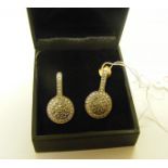 A pair of silver gilt ear drops set with approximately 38 diamonds (diamonds tested), marked to