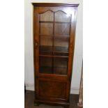 A walnut display cabinet. CONDITION REPORT: Note: we do not offer an in house postage service, we