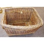 A large antique industrial wicker mill basket on wheels, with makers mark Arthur Craven