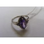 A 9ct white gold ring set with an amethyst & diamonds. Size N. CONDITION REPORT: In good condition.