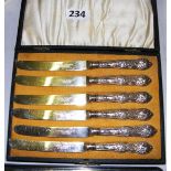 A cased set of sterling silver handled tea knives,