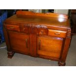 An Art Deco carved sideboard. CONDITION REPORT: Note: we do not offer an in house postage service,