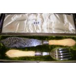 A cased set of bone handled fish servers with pierced decoration & silver ferrules hallmarked for