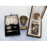 A cased sterling silver spoon & pusher & a eastern cased christening mug & napkin set.