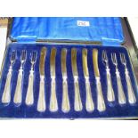 A set of knives & forks with sterling silver ferrules in case.