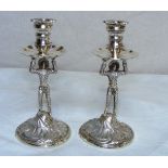 A pair of solid sterling silver figural candlesticks hallmarked London 1975 weighing 283 grams