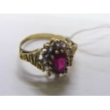 A 9ct gold ring set with a ruby twelve surrounding zirconia diamonds, shank marked 375. Size P 1/