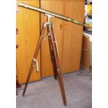 A solid brass "Ross London" telescope on tripod stand.