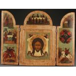A LARGE RUSSIAN ICON TRIPTYCH, 19TH CENTURY. At center the Holy Visage beneath the Last Supper.  The