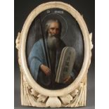 A RUSSIAN ICON OF THE OLD TESTAMENT PROPHET MOSES, CIRCA 1800. Executed in an oval reserve within an