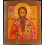 AN OVERSIZED RUSSIAN ICON OF ST. KHARLAMPIY, 19TH CENTURY. Depicted as a Bishop delivering a
