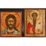 A PAIR OF RUSSIAN ICONS, 18TH CENTURY. Comprising a provincial icon of Christ and a Bishop Saint,