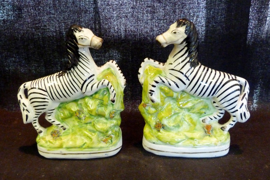 A Pair of Staffordshire Models of Zebra,