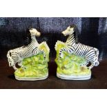 A Pair of Staffordshire Models of Zebra,