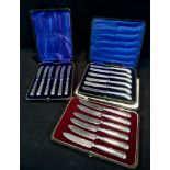 Three Cased Sets of Silver Handled Tea K