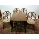 An Ercol Drop Leaf Dining Table, togethe