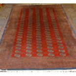 A Bokhara Woollen Rug with five rows of