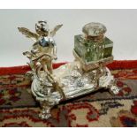 A Silver Plated Ink Stand with cherub su