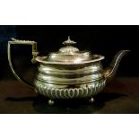 A George III Silver Teapot of Half Lobed