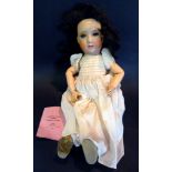 An Early 20th Century Bisque Head Doll b