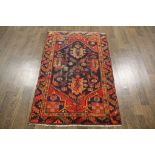 A North West Persian Woollen Rug, with a