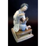 A Lladro Porcelain Figure in the form of