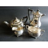A Sheffield Silver Four Piece Tea Service, comprising teapot, hot water pot,