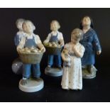 Two Royal Copenhagen Porcelain Models of Boys with Baskets of Fruit,