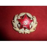 Badge Russia - Communist era officers cap badge. Gilt and red enamel, wire fittings. Red enamel