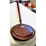 Antique copper bed-warming pan.