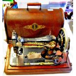 Vintage original or earlier Singer Sewing Machine, with original cover and accessories