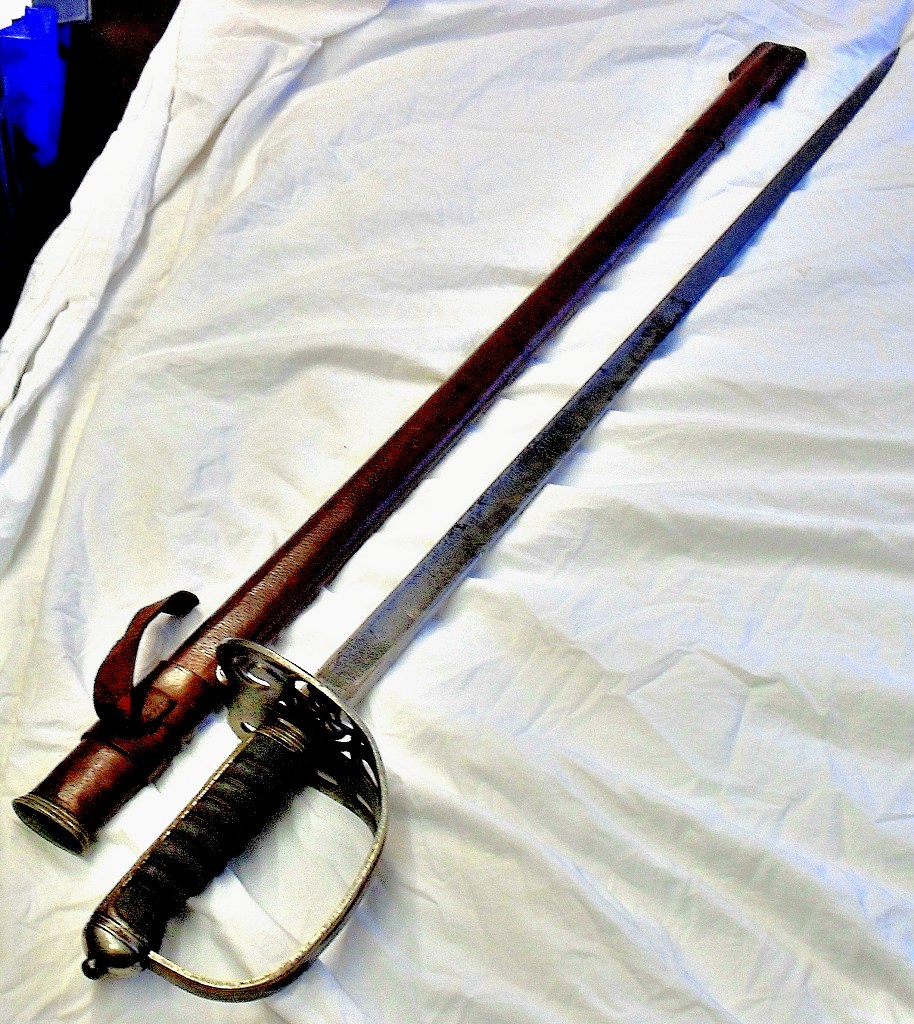 WWI Officers Rifle Brigade Sword (GRV) By Moss Bros in brown leather scabbard. Good Clean