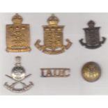 Indian Ordnance Corps cap badges (4) with a shoulder title and button. Includes: WWI and WWII Indian