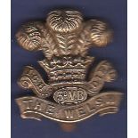 WWI The Welsh Regt 3rd Volunteers Battalion Cap Badge. (White Metal)