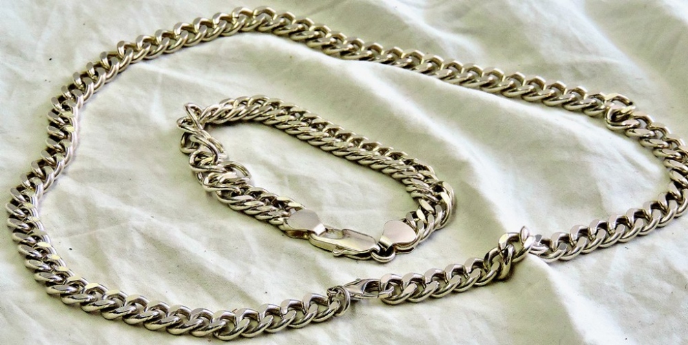 Silver bracelet  Marked 0.925 (24g) and a matching silver necklace (unmarked).