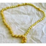 An attractive neck-lace  Antique beads with chrysanthemums/camellias.