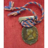 "The Soldiers and Sailors Families Association MDCCCLXXXV" Red and Blue twist Cord, Bronze Medal,