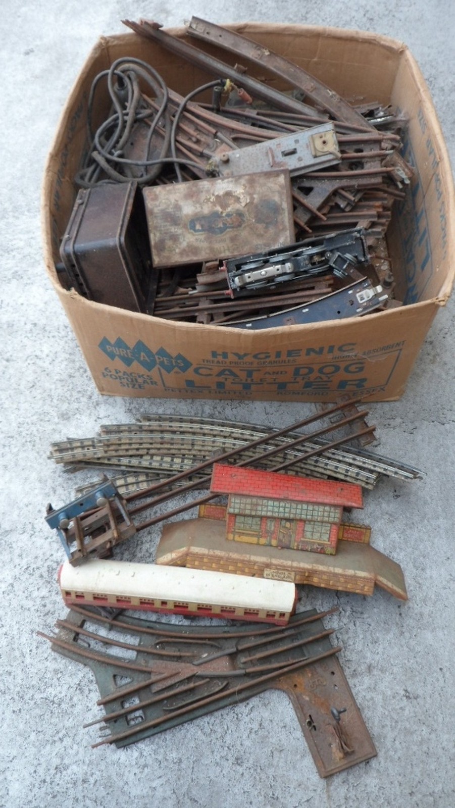 Box of Railway Track mostly 'O' Track some 'OO' with carriage and buildings all for restoration.