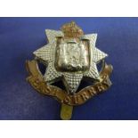 The East Surrey Regiment, Bi Metal with KC. A Scarce cap badge.