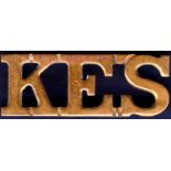Metal Shoulder Title  'K.E.S.' in brass, King Edwards School.