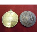 A King George V and Queen Mary Coronation Medal from 1911 and a King George V visit to