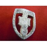 A vintage World War II  Period Estonian Tinnier badge 'Juveniles' Damage to the metal.