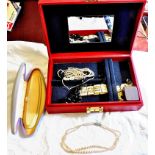 Red Jewellery Box Contains pearls and other necklaces and a grey box containing pearls.