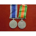 GRVI Police Long Service Medal with 1939-45 Defence medal to Sergeant Richard Williams.