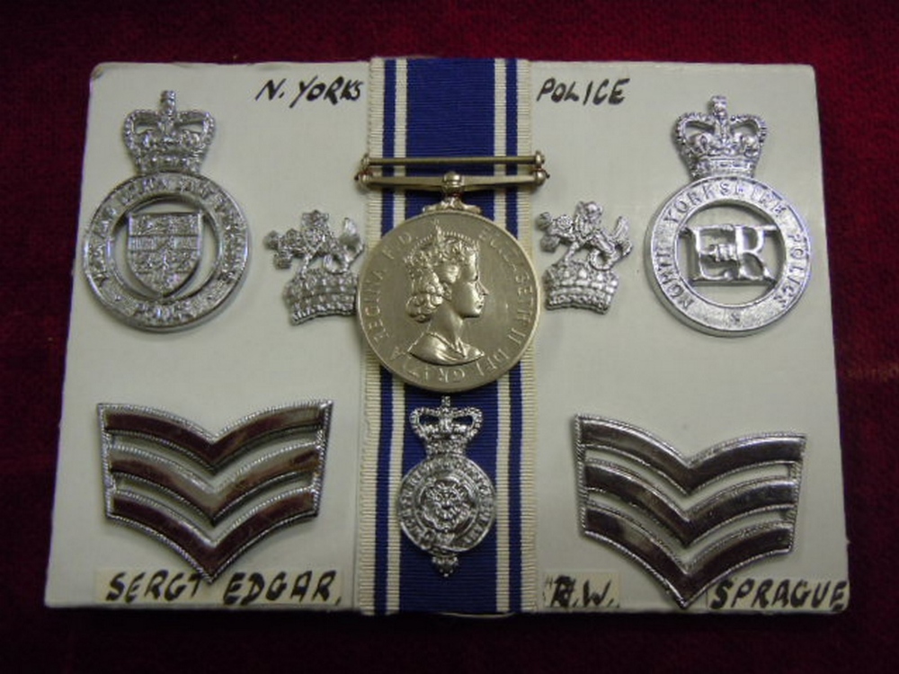 ERII Police Long Service and Good Conduct Medal with a selection of Police Badges etc to a