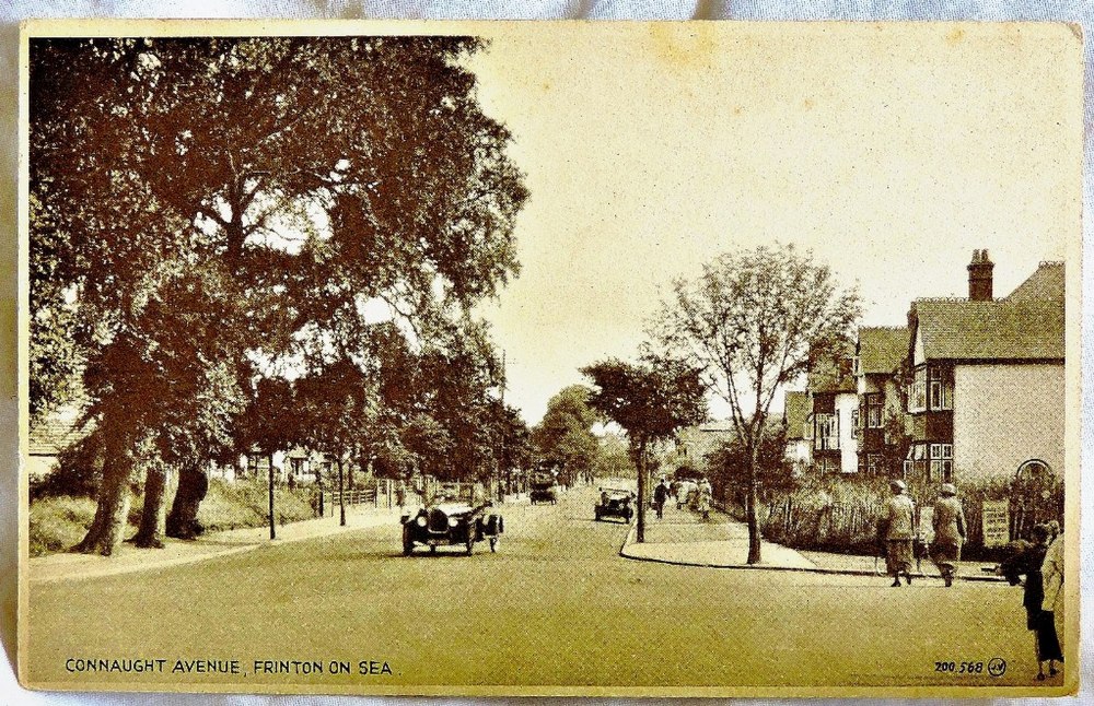 Essex - Frinton On Sea  Connaught Avenue.  Some activity + vintage auto's.