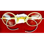 1950's round cream-coloured plastic covered steel framed, cable armed spectacles. Fair condition.