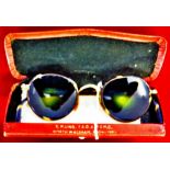 Vintage possible 1960's sunglasses with green variegated lenses. Faux tortoiseshell and gilt frame