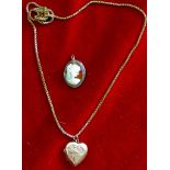 Gold - 9ct Locket & a Cameo Brooch  9ct gold heart locket and a Silver backed Cameo Brooch